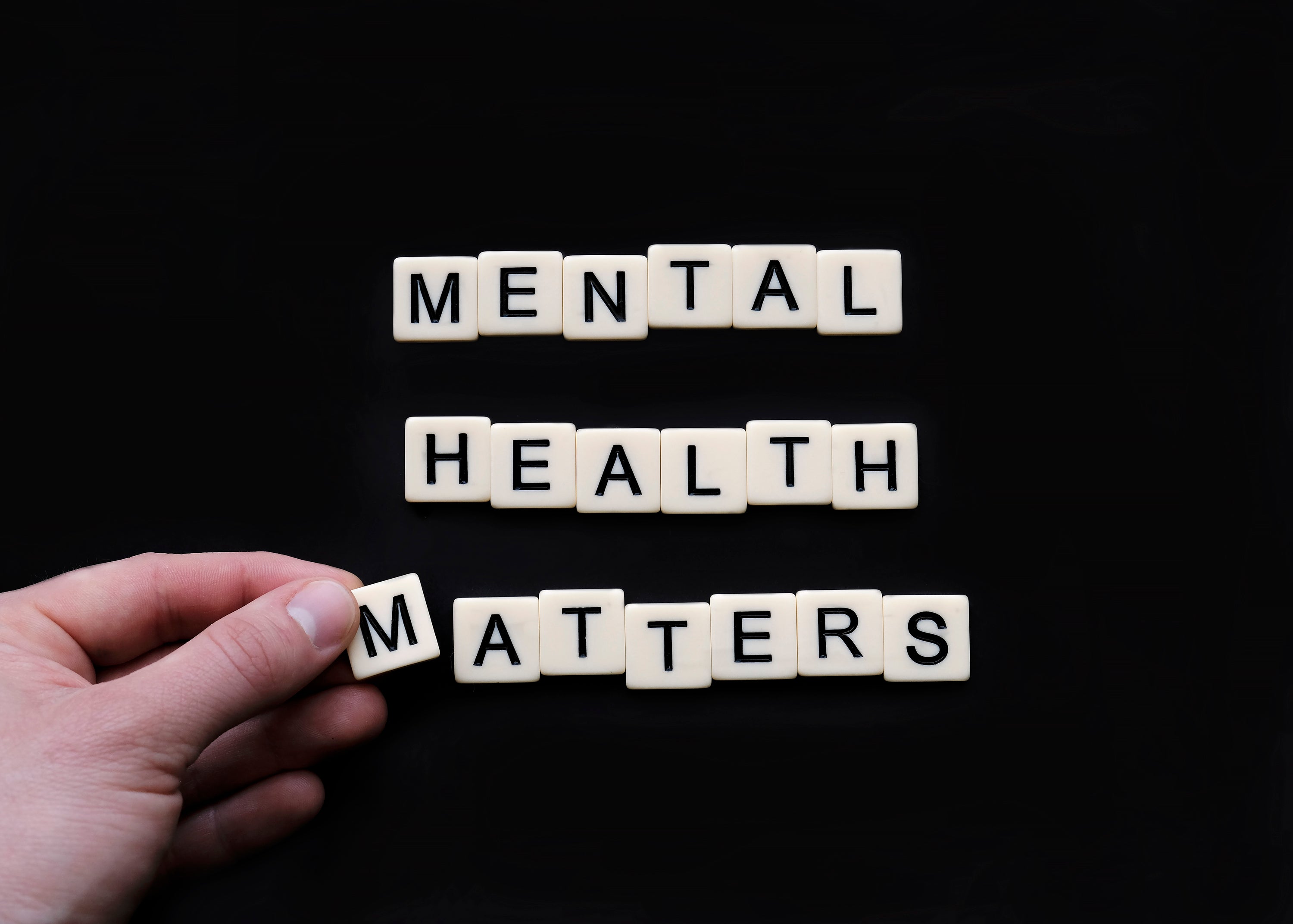 tiles-lay-on-a-black-surface-reading-mental-health-matters.jpg